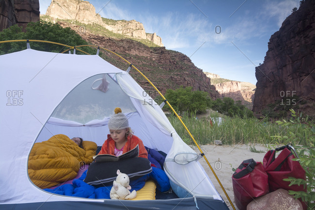 A mother and daughter camping along the Gates of Lodore, Green River, Dinosaur National Monument, Colorado.