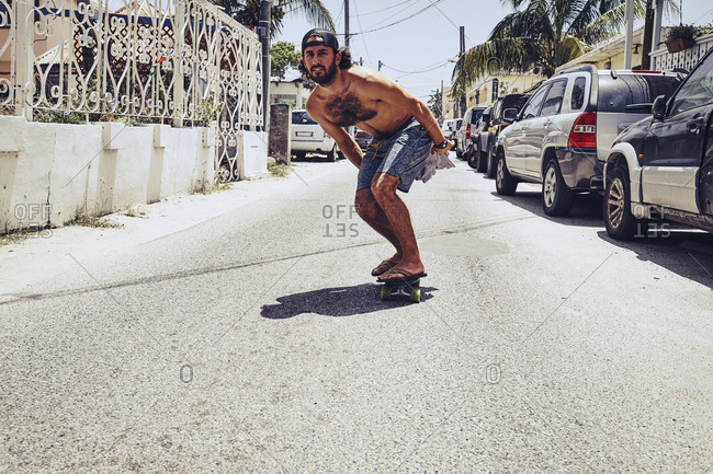 Young man skateboarding on the street