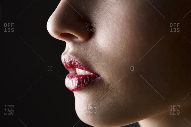 Close up of a woman with pink lip color