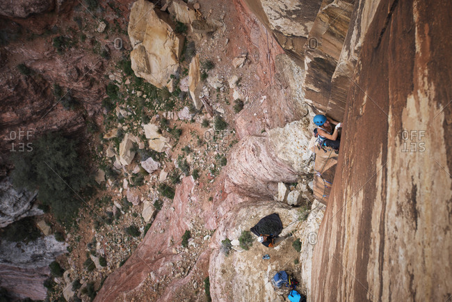 Two people rock climbing