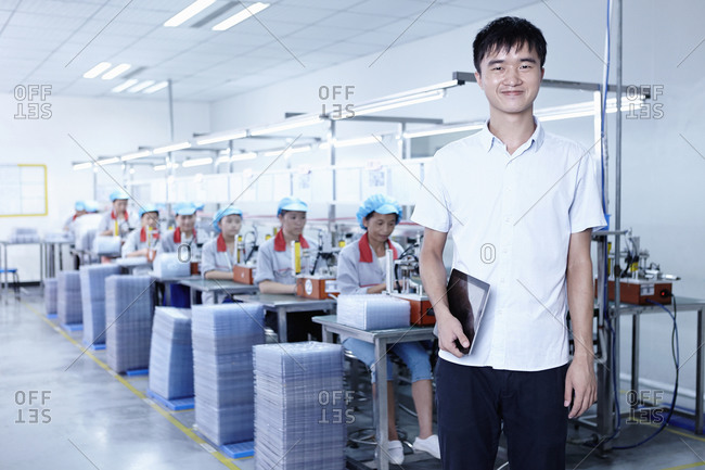Worker at e-cigarettes battery factory, Guangdong, China