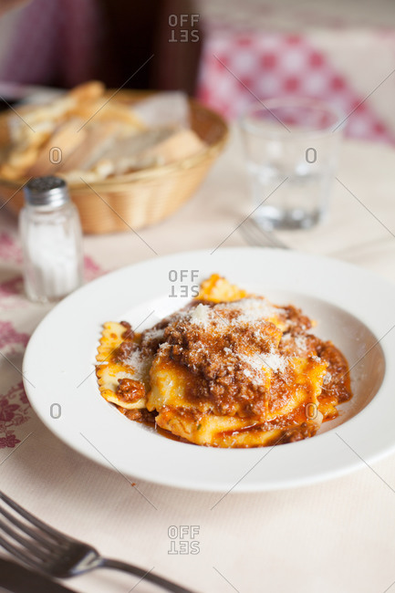 Plate of ravioli with potato filling and sauce of wild boar and tomato, Tuscany, Italy