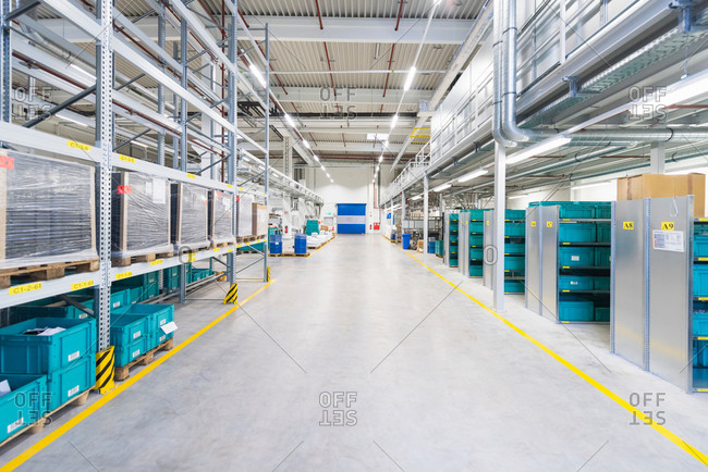 Aisle of industrial warehouse with storage shelving
