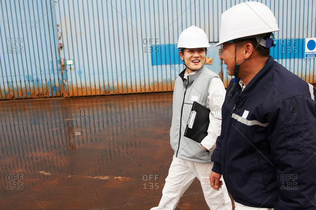 Workers walking through shipyard, GoSeong-gun, South Korea