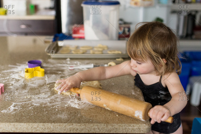 Girl holding a rolling pin
