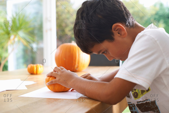 Boy drawing at dining table
