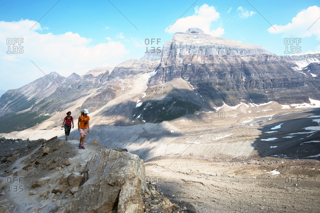 Caucasian mother and daughter hiking on Six Glaciers Trail, Banff, Alberta, Canada