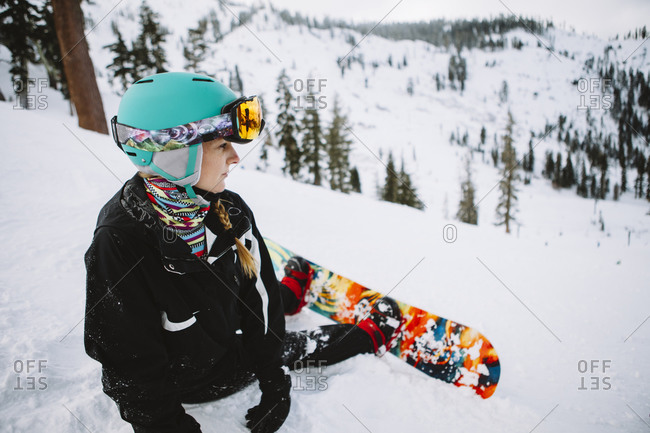 A woman snowboarding in Lake Tahoe