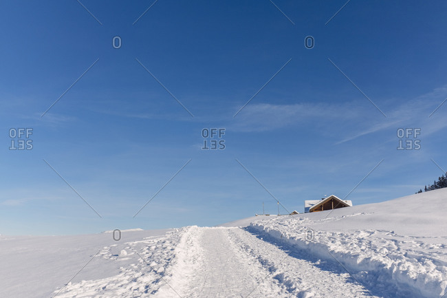 Path through snow on hill