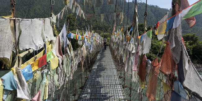 Colourful prayer flags lining a walkway; Thimphu, Bhutan