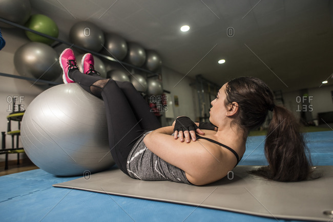 Woman abs training with fitness ball