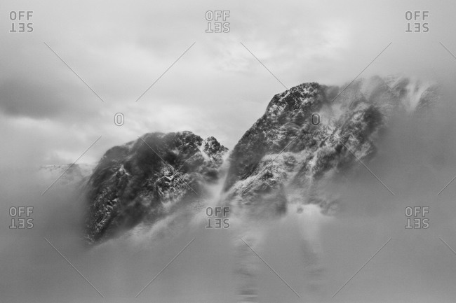 View of mountains through foggy car window