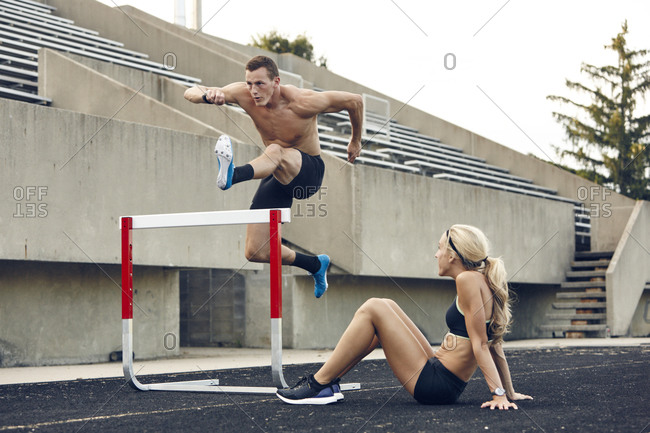 Steeplechaser jumping over barrier