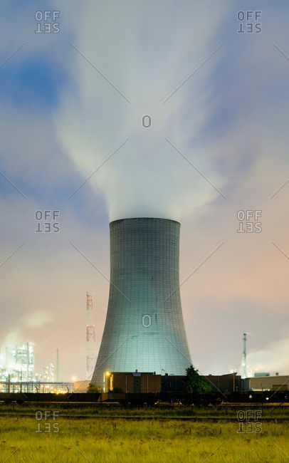 Cooling tower on a chemical plant in Antwerp harbor at night , Antwerp, Belgium
