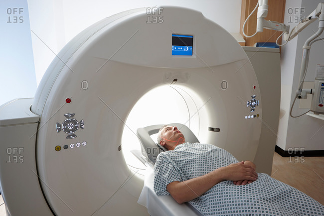 Man coming out of a CT scanner