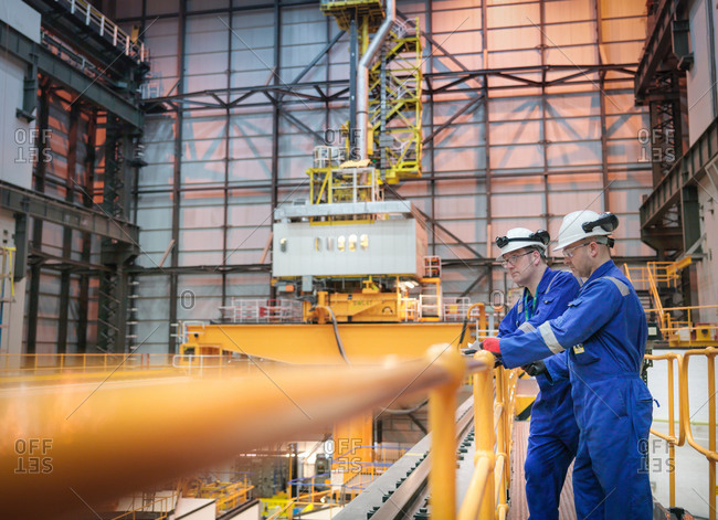 Engineers inspecting reactor hall in nuclear power station