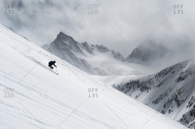 Mid adult man skiing down steep hill, Obergurgl, Austria