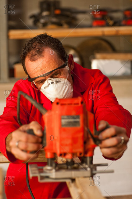 Carpenter working with power tools