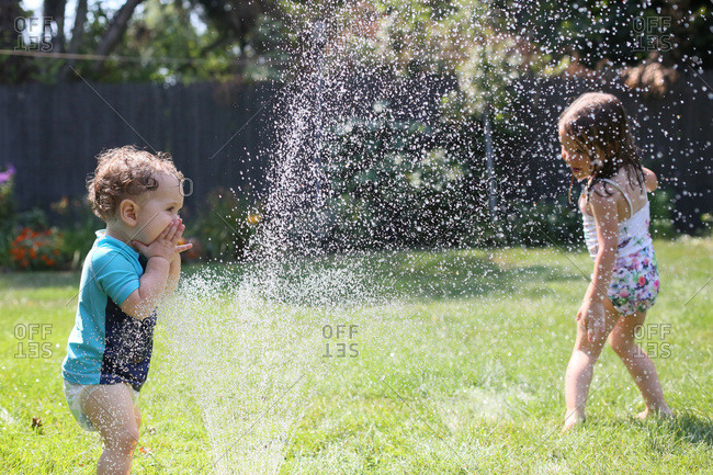Playing in the sprinkler