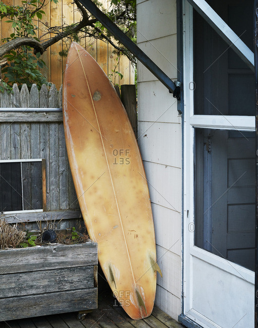 Surfboard propped on deck