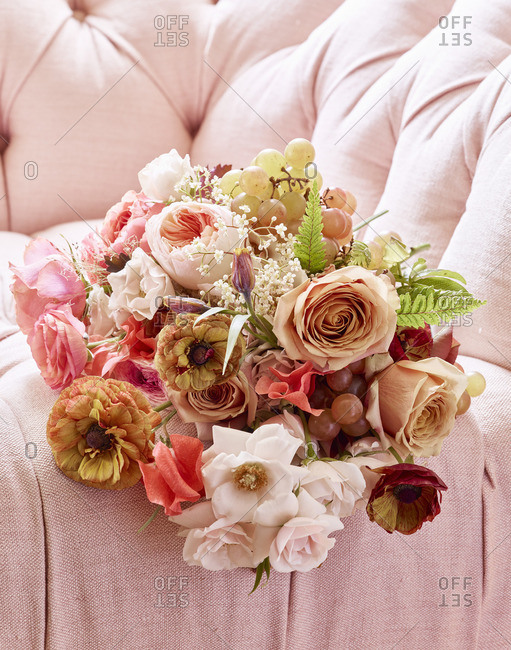 Floral bouquet on pink couch