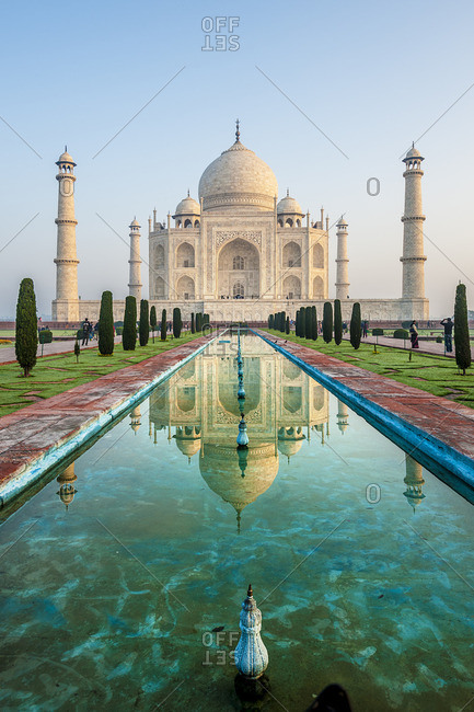 The grand facade of the Taj Mahal reflected in the adjacent pool