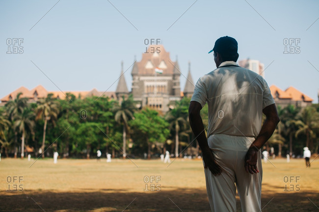 Man watching cricket match, Mumbai
