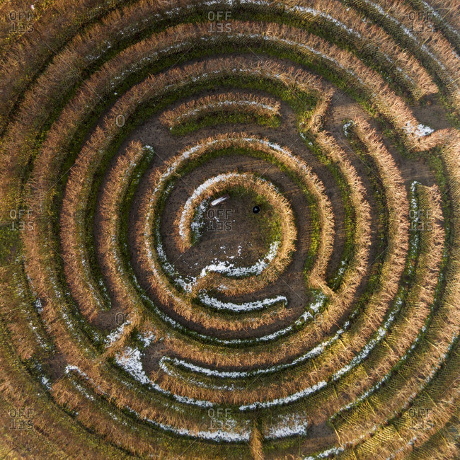 Circular maze dusted with snow in a field in Lithuania