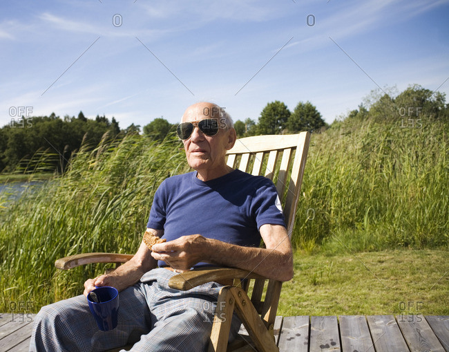 An old man in a sun chair