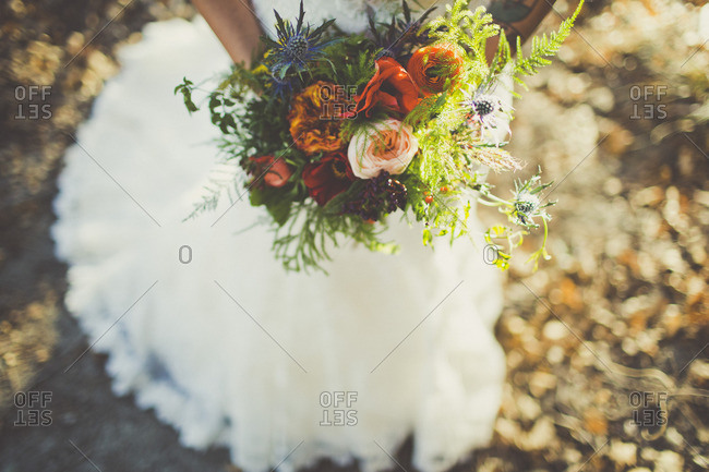 Bride holding varied floral bouquet