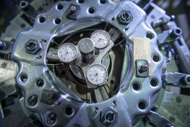 Close up of assembled industrial clutch on production line, overhead view