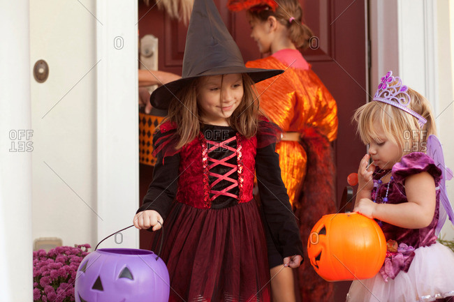 Children in costume trick or treating