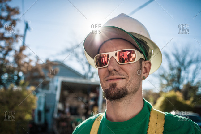 Portrait of solar panel installation crew member