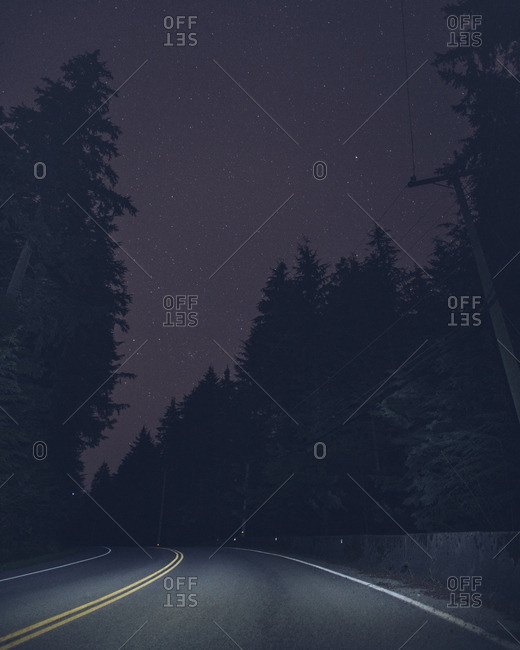 Starry sky above two lane highway