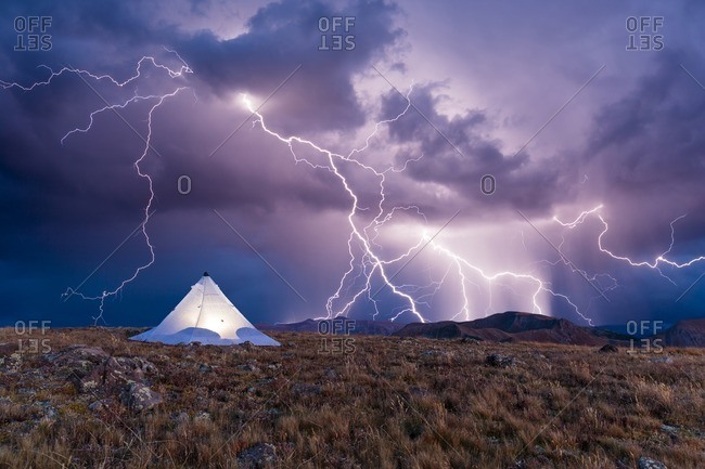 Conceptual composite of backpacking tent on alpine ridge in the South San Juan Wilderness