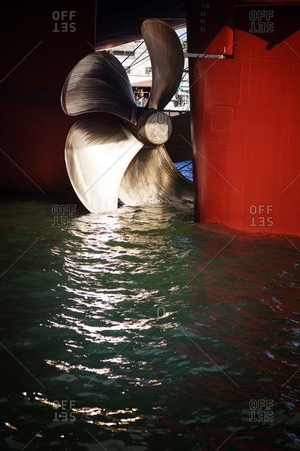 Close-up of propeller on container ship in water