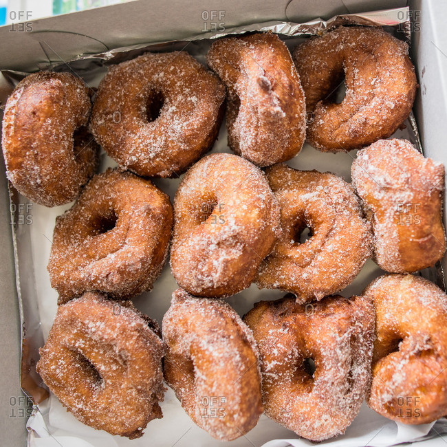 Close up of a boxful of malasadas (Portuguese donuts), Hawaii, USA