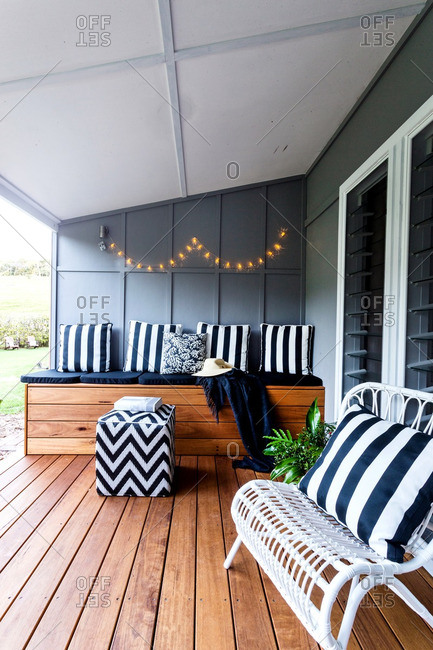 Wooden deck with bench and pillows
