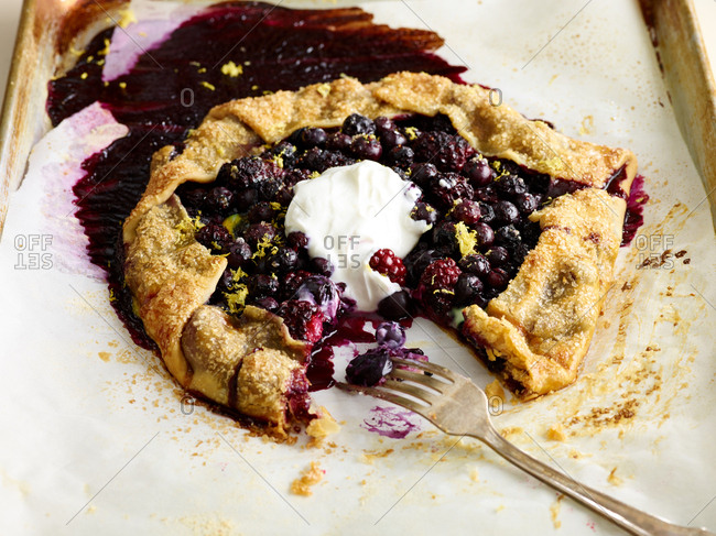 Mixed berry tart with whipped cream