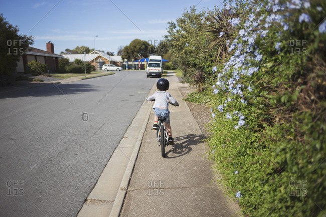 riding bicycle on sidewalk