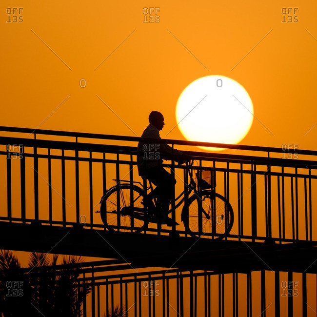 Person on bike in Dubai sunset