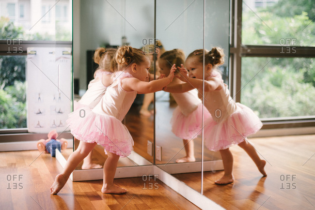 Girl at mirror in ballet dress