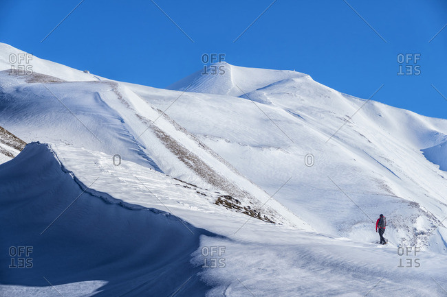 Hiker on mountain Vettore in winter