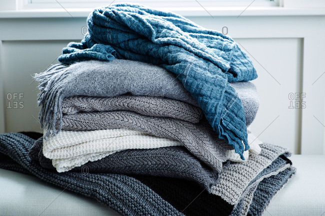 Stack of blue and gray wool blankets