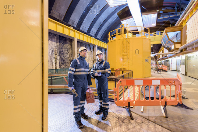 Workers arriving at a generating hall in hydroelectric power station