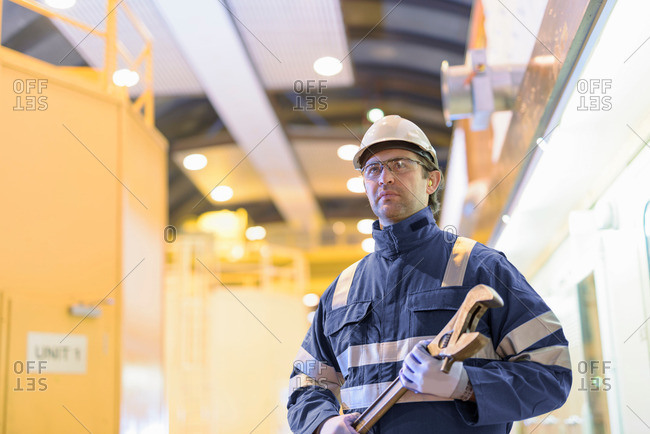 Portrait of worker in generating hall in hydroelectric power station