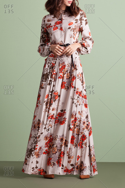 Woman in a retro floor-length floral dress