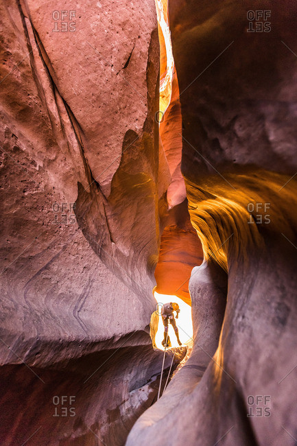 Climber canyoning in Neon Canyon