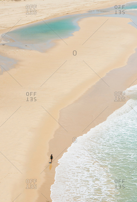 Person walking on Seventy-five Miles Beach, Fraser Island, Queensland, Australia
