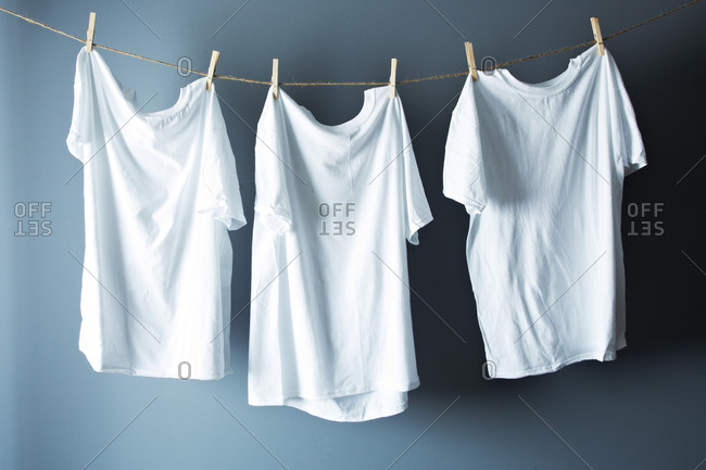 White T-shirts hanging on line